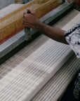 Silica Chalk Off White And Gray Stripes Pattern Soft Handwoven Merino Throw being woven by hand.