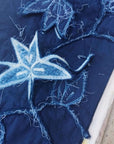 Folio Indigo Handcrafted Shibori Cotton Table Napkins ( set of 4 ) showcasing intricate blue shibori patterns on cotton.