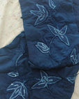 Folio Indigo Handcrafted Shibori Cotton Table Napkins ( set of 4 ) featuring intricate floral design on deep blue background.