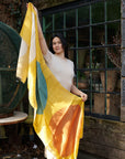 Cirq Sun Yellow Green Circle Pattern Hand Embroidered Linen Silk Handloom Scarf displayed by a model outdoors.