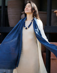 Midnight Navy Blue Hand Woven Linen Silk Blend Scarf elegantly worn with a neutral outfit, showcasing its versatility.