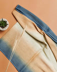 Oceana Beige Soft Linen Silk Handloom Scarf displayed on a beige background with a small plant.