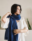 Midnight Navy Blue Hand Woven Linen Silk Blend Scarf worn elegantly by a model, showcasing its stylish design.