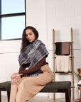 Woman draped in Alloy Dark Blue Stripes Pattern Soft Merino Linen Handloom Throw, showcasing the throw's elegance.