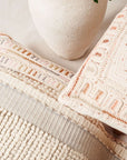 Dahli Coral Artisanal Hand Embroidered Pillow Cover showcasing intricate details and textures with a neutral aesthetic.