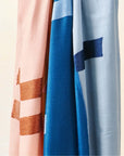 Canyon Hand Embroidered Hand Woven Merino Silk Soft Scarf in soft colors and intricate embroidery hanging elegantly.