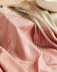 Chive Pink Green Ombre Handloom Merino Throw displayed elegantly, showcasing its unique colors and hand-embroidered detail.