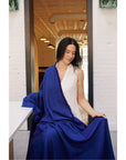 Cobalt Blue Herringbone Plush Soft Merino Handwoven Throw By Variously draped by model