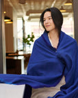 Cobalt Blue Herringbone Plush Soft Merino Handwoven Throw By Variously draped on a mode