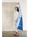 Harbor Blue Silk Merino Hand Woven Hand Embroidered Modern Artisanal Scarf being showcased elegantly by a model.