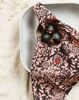 Hummus Floral Wax Block Printe Cotton Table Napkin( set of 4 ) wrapped around a bowl with figs.