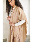 Woman wearing a Maple Beige Handwoven Hand Embroidered Classic Scarf with unique patterns.
