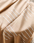 Maple Beige Handwoven Hand Embroidered Classic Scarf with white embroidered patterns on a beige fabric.
