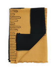 Handwoven Topaz Brown Myrtle Drift Merino Throw featuring artistic pattern and contrasting borders.
