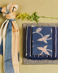 Oceana Beige Soft Linen Silk Handloom Scarf displayed with other textiles on a neutral background.