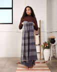 Alloy Dark Blue Stripes Pattern Soft Merino Linen Handloom Throw displayed by a model in a modern indoor setting.