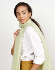 Soya Pastel Lime Green Hand Woven Soft Linen Scarf worn by a model, showcasing its texture and color.
