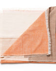 Chestnut Orange Cream Color Block Handwoven Merino Throw showcasing a luxurious design and unique craftsmanship.