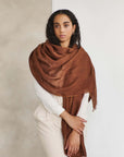 Coco Brown Hand Woven Linen Silk Blend Scarf elegantly styled on a model, showcasing its soft texture and versatile appeal.