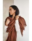 Coco Brown Hand Woven Linen Silk Blend Scarf worn elegantly by model, showcasing its soft texture and beautiful color.