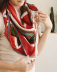 Fawn Square Silk Artisanal Scarf In Multicolor Hand Crafted Shibori Print styled elegantly around the neck.