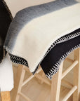 Ink Black White Ombre Textured Throw In Hand Spun Merino And Hand Stitched Hem showcasing handwoven texture.