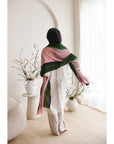 Iris Kiwi Green Pink Cashmere Merino Handwoven Scarf worn elegantly by a model in a minimalist indoor setting.