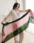 Iris Kiwi Green Pink Cashmere Merino Handwoven Scarf displayed by a model, showcasing its unique colors and craftsmanship.