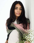 Iris Kiwi Green Pink Cashmere Merino Handwoven Scarf draped elegantly on model with flowers.