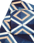 Tisa Indigo Hand Crafted Shibori Print Cotton Table Napkin set of 4 featuring a geometric blue and ivory design.