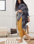 Model showcasing Alloy Dark Blue Stripes Pattern Soft Merino Linen Handloom Throw draped elegantly.