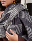 Alloy Dark Blue Stripes Pattern Soft Merino Linen Handloom Throw styled on a model's shoulders showcasing its elegant design.
