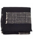 Walnut Black Yak With Hand Knotted Merino Stripes Handloom Throw folded on a white background.