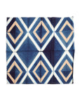 Tisa Indigo Hand Crafted Shibori Print Cotton Table Napkin set of 4 with geometric pattern in blue and beige.