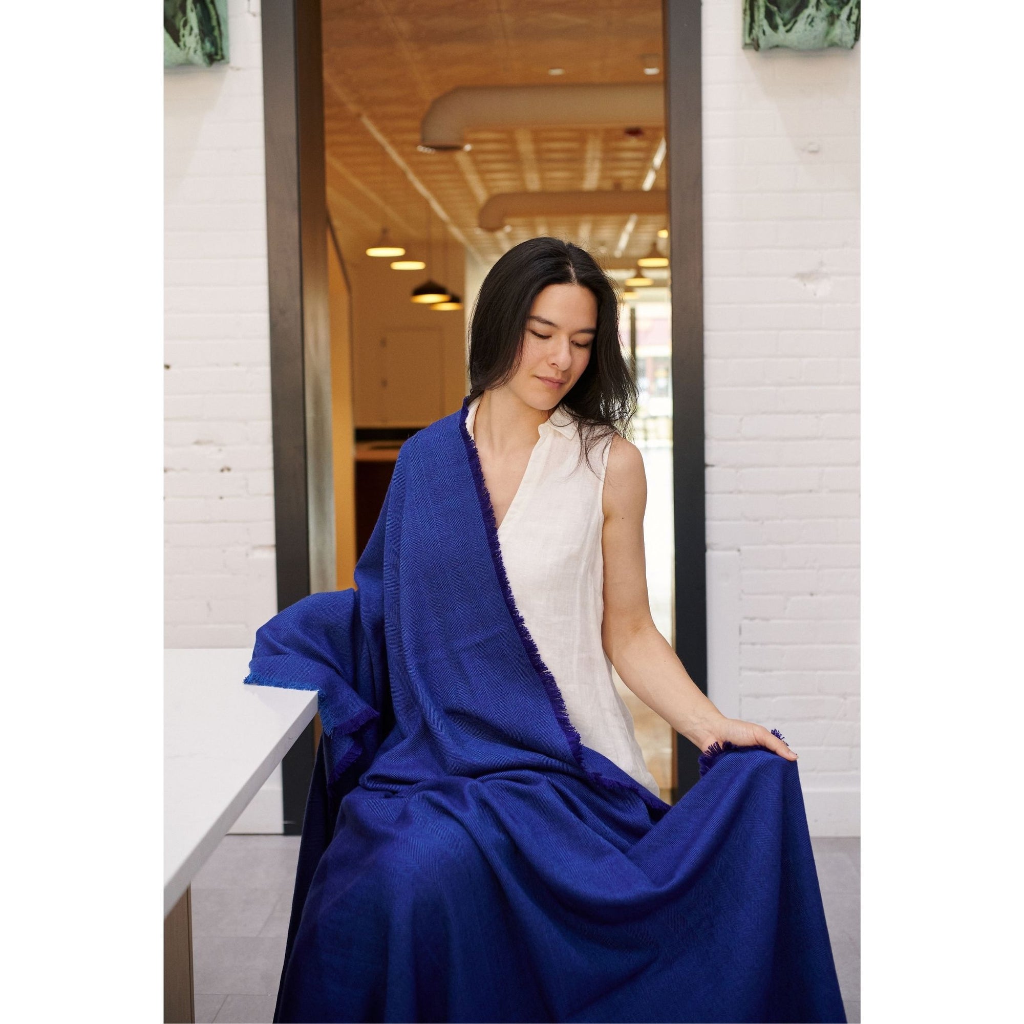 Cobalt Blue Herringbone Plush Soft Merino Handwoven Throw   By Variously  draped by model