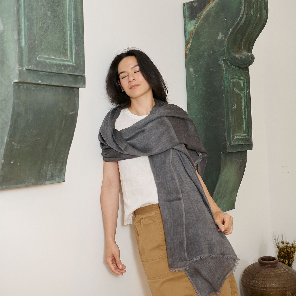 Charcoal Dark Gray Hand Woven Soft Linen Silk Blend Scarf draped elegantly on a model in a minimalistic setting.