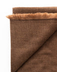 Hay Brown Twill Merino Handwoven Throw showcasing its soft twill weave and fringe detail.