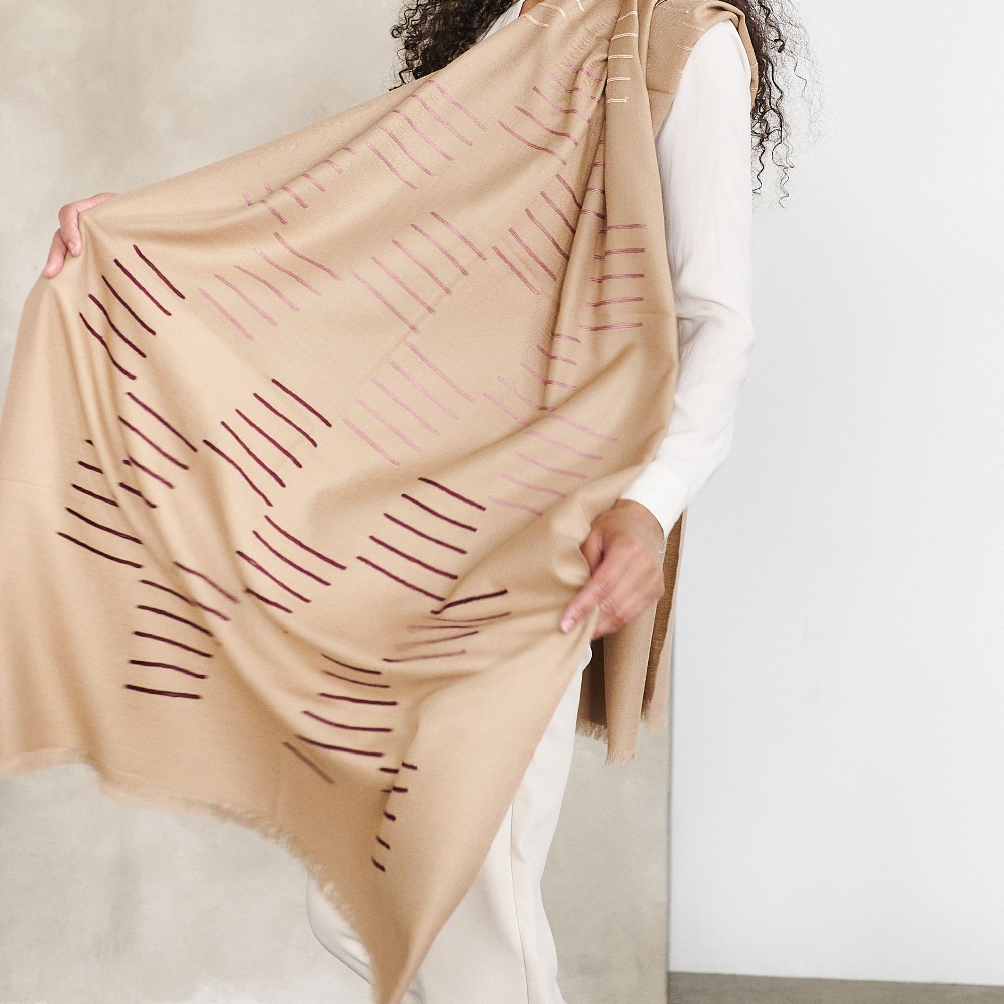 Maple Beige Handwoven Hand Embroidered Classic Scarf featuring unique patterns and textures, worn elegantly.