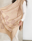 Maple Beige Handwoven Hand Embroidered Classic Scarf featuring unique patterns and textures, worn elegantly.
