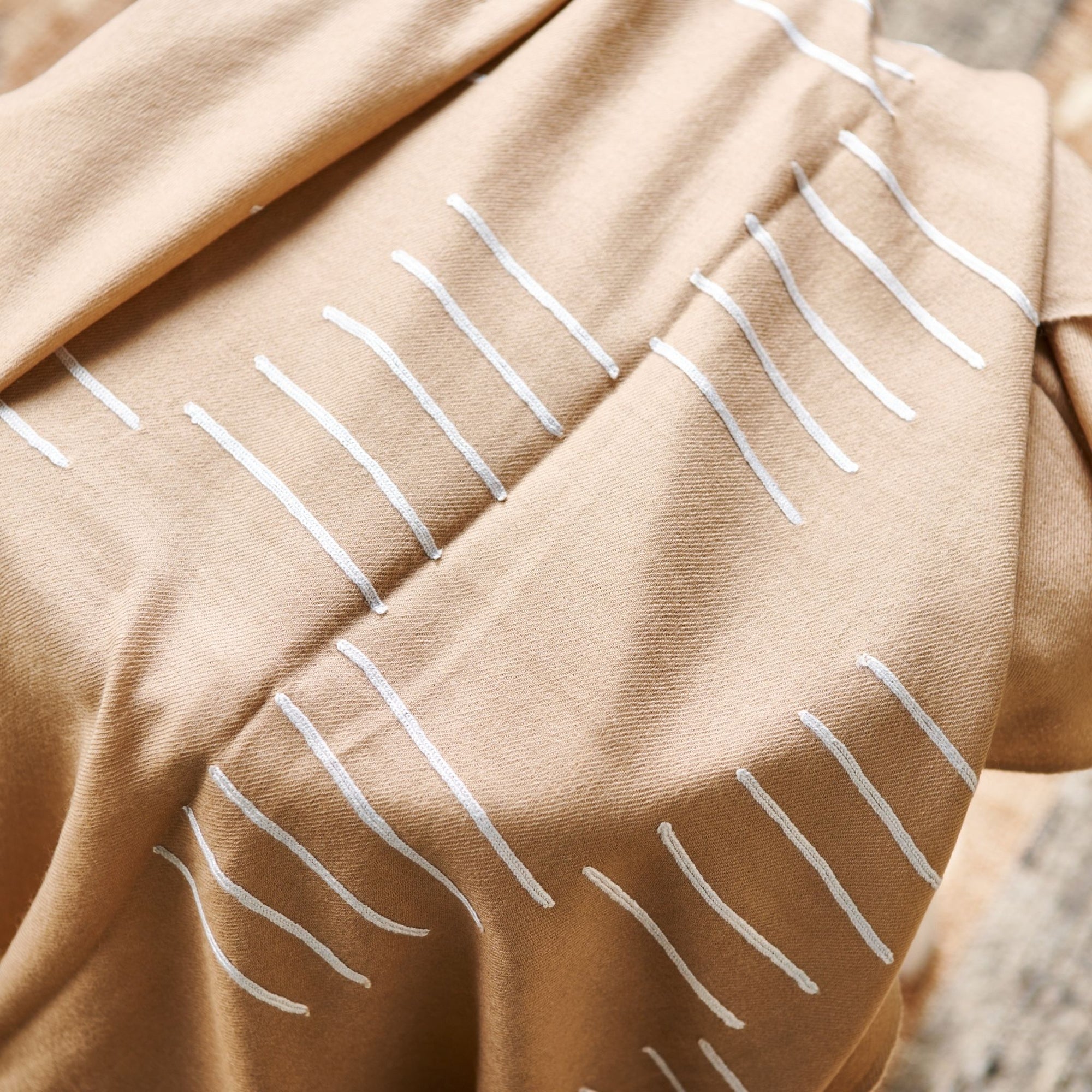 Maple Beige Handwoven Hand Embroidered Classic Scarf with white embroidered patterns on a beige fabric.