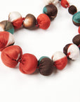 Mihika Red Silk Beaded Necklace Modern Artisanal close-up of handcrafted silk beads in vibrant colors.
