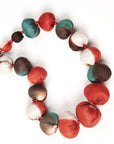 Mihika Red Silk Beaded Necklace Modern Artisanal showcasing handcrafted silk beads in vibrant colors.