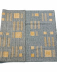 Ash Blue Gray Jute Handwoven Geometric Pattern Rug featuring a unique design with geometric patterns in blue and beige.
