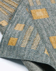 Close-up of the Ash Blue Gray Jute Handwoven Geometric Pattern Rug showcasing detailed patterns and textures.