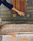 Ash Blue Gray Jute Handwoven Geometric Pattern Rug showcased with diverse textured throw pillows.