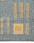 Ash Blue Gray Jute Handwoven Geometric Pattern Rug with yellow geometric designs close-up.