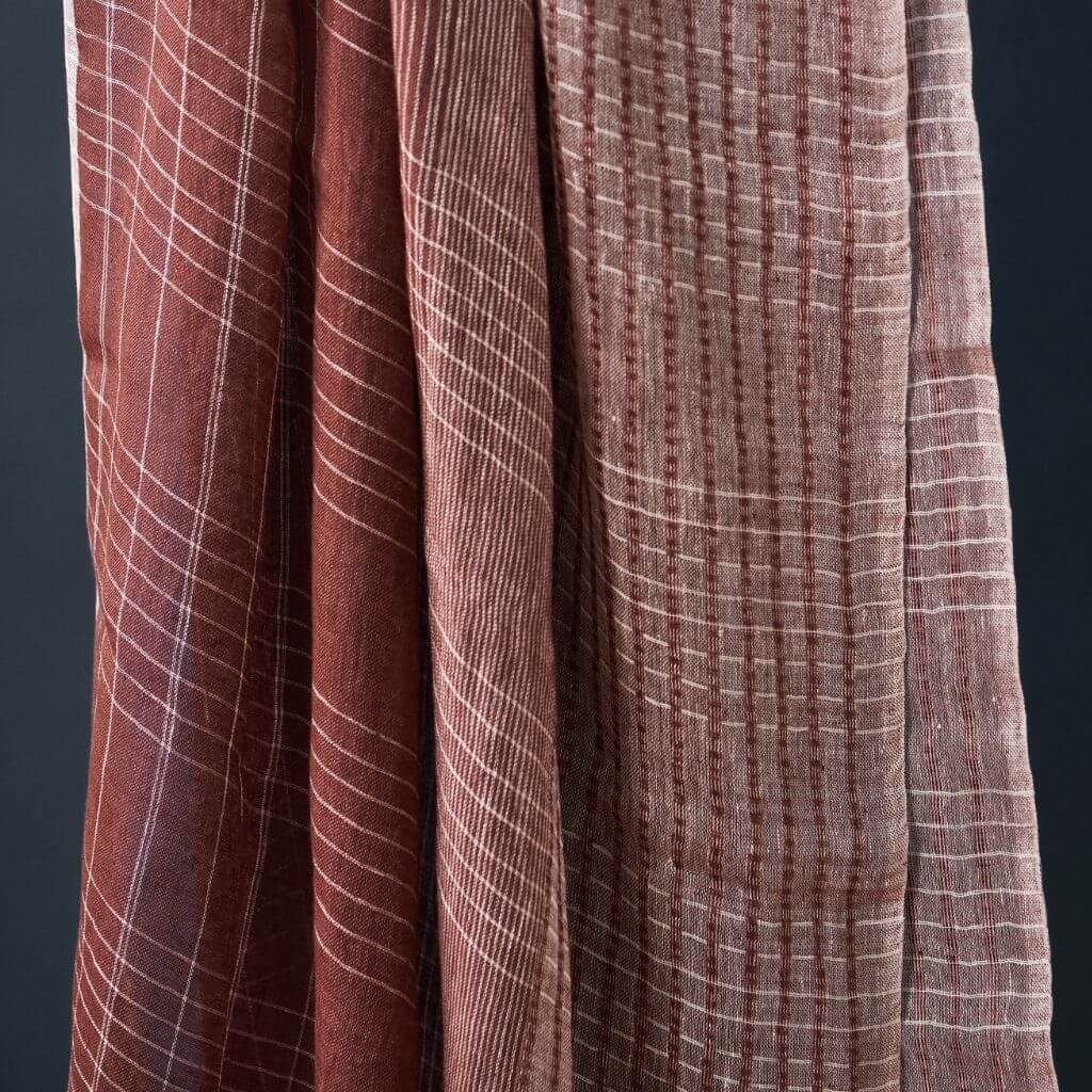 Auro Cinnabar Handwoven Earthy Rust Maroon Linen Scarf showcasing natural texture and unique pattern.