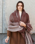 Auro Cinnabar Handwoven Earthy Rust Maroon Linen Scarf draped elegantly over a model against a textured wall.