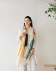 Cirq Moon Off White Multi Color Circle Pattern Hand Embroidered  Linen Silk Handloom Scarf worn by a woman.