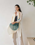 Cirq Moon Off White Multi Color Circle Pattern Hand Embroidered Linen Silk Handloom Scarf worn by a model.